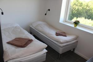 Postel nebo postele na pokoji v ubytování ICV SleepWell