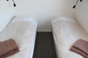 Postel nebo postele na pokoji v ubytování ICV SleepWell