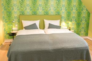 Кровать или кровати в номере Visbeker Deern Hotel Garni