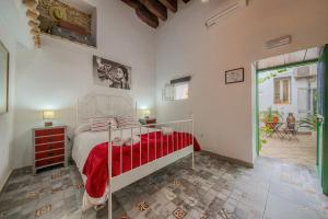 Łóżko lub łóżka w pokoju w obiekcie Apartamentos Jerez