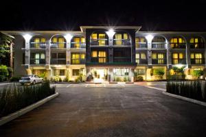 a large building with a car parked in front of it at Hotel Vue in Mountain View