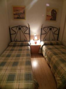 Posteľ alebo postele v izbe v ubytovaní Bonito Apartamento con varias piscinas + 24 fotografií
