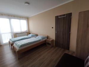 Postel nebo postele na pokoji v ubytování U Vrbů