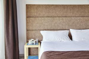 Voodi või voodid majutusasutuse Baia di Conte Resort toas