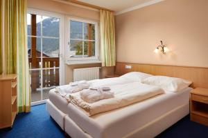 Cama ou camas em um quarto em Mountain Home Zugspitze