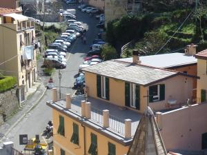 an aerial view of a city street with cars parked at Riomaggiore Attico in Riomaggiore +3 photos