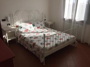 Postel nebo postele na pokoji v ubytování Villetta le Rose