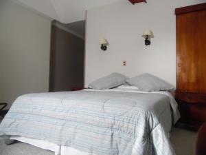 Krevet ili kreveti u jedinici u okviru objekta Hotel Isla Rey Jorge
