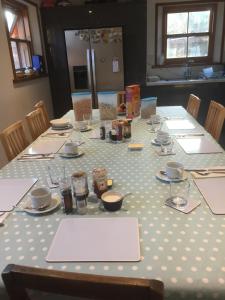 a table with a white polka dot table cloth at The Old Dairy B and B in Salisbury