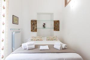 Lova arba lovos apgyvendinimo įstaigoje Sant'Agostino Apartment by DomuSicily