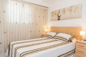 Posteľ alebo postele v izbe v ubytovaní Los Olivos Apartment Cullera