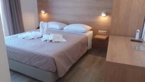 Posteľ alebo postele v izbe v ubytovaní International Hotel