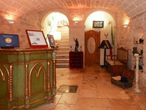 a hallway with a staircase and a room with a stair case at Palazzo Antica Via Appia in Bitonto