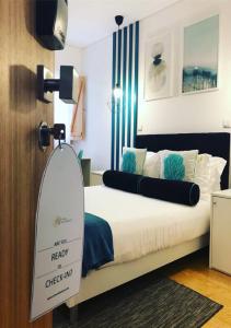 Postel nebo postele na pokoji v ubytování Bellu Suites