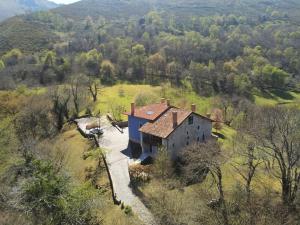 an aerial view of a house in a field at Hotel Rural El Pandal in Ardisana