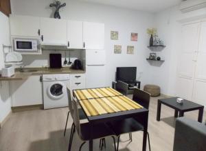 Kuchyň nebo kuchyňský kout v ubytování Apartamentos Capuchinas