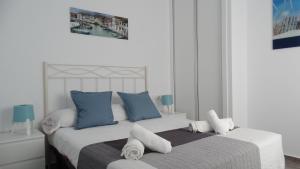 Ένα ή περισσότερα κρεβάτια σε δωμάτιο στο apartamento rio salado