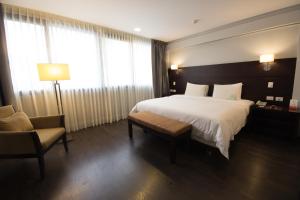 Rúm í herbergi á Unipark by Oro Verde Hotels
