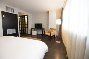 Rúm í herbergi á Unipark by Oro Verde Hotels