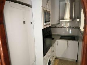 Kuchyň nebo kuchyňský kout v ubytování Apartamento Luz