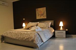 A bed or beds in a room at B&B Relais Aeclanum