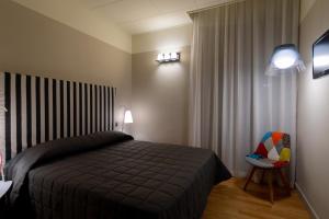 Postel nebo postele na pokoji v ubytování Hotel Moderno