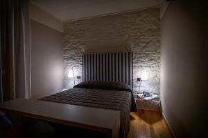 Postel nebo postele na pokoji v ubytování Hotel Moderno