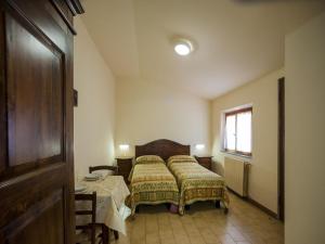 Posteľ alebo postele v izbe v ubytovaní Camping Village Mugello Verde