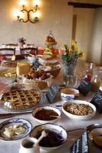 a table full of food on a table at Domus Cariana in San Pietro in Cariano