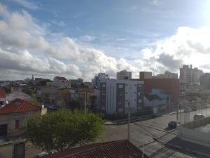 a view of a city with buildings in the background at Pousada Tchê Aprochega in Pelotas +14 photos