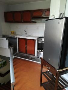 Kuchyň nebo kuchyňský kout v ubytování Mini Departamento Tambo Huascar 2