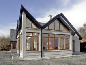 a house with large windows on the side of it at Westport, Co. Mayo - Sleeps 10, Pool Table, ideal holiday base in Westport