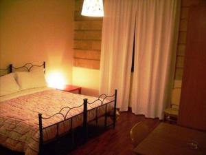 Letto o letti in una camera di Albergo Conca D'Oro