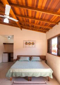 Ένα ή περισσότερα κρεβάτια σε δωμάτιο στο Suítes Yamamoto Ilhabela