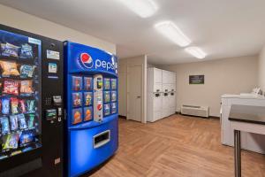 a room with a pepsi vending machine in a store at Extended Stay America Suites - Charlotte - University Place in Charlotte
