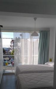 Katil atau katil-katil dalam bilik di Coco Lodge Paracas