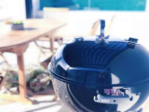 a blue helmet sitting in front of a table at Luxury Onyx Penthouse with Sea Mountain Views by CTICC Cape Town in Cape Town