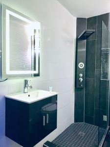 a bathroom with a sink and a shower at Modern Suite #1 Pasavento in Aguadilla