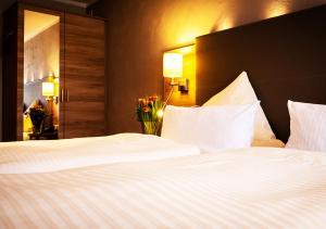 Postel nebo postele na pokoji v ubytování Hotel Morjan