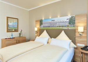 Ένα ή περισσότερα κρεβάτια σε δωμάτιο στο Hotel Morjan