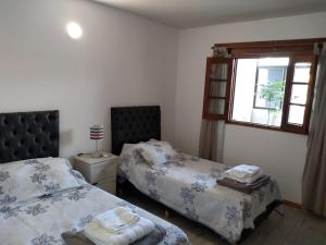 Postel nebo postele na pokoji v ubytování Casa confortable