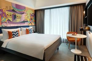 ibis Styles Jakarta Tanah Abang客房内的一张或多张床位