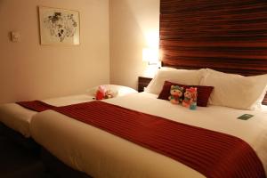 Postel nebo postele na pokoji v ubytování Jinglun Hotel Beijing