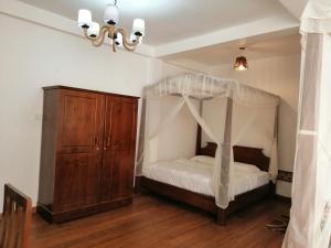 Rúm í herbergi á Melford Nuwaraeliya