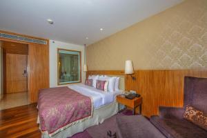 Postel nebo postele na pokoji v ubytování Hotel Bawa International