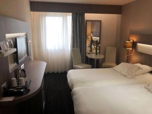 Postel nebo postele na pokoji v ubytování Best Western Marseille Aeroport