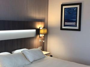 Postel nebo postele na pokoji v ubytování Best Western Marseille Aeroport