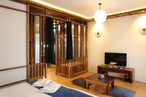 TV a/nebo společenská místnost v ubytování Tharaburi Resort