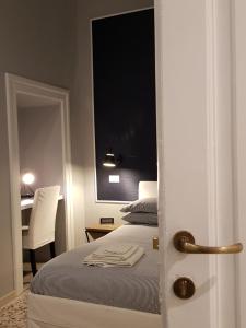 Posteľ alebo postele v izbe v ubytovaní MammaDada charm rooms