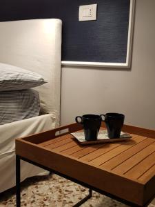 Posteľ alebo postele v izbe v ubytovaní MammaDada charm rooms